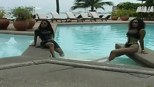 2 sexy Latina's presenting latex fetish in the pool and on the beach
