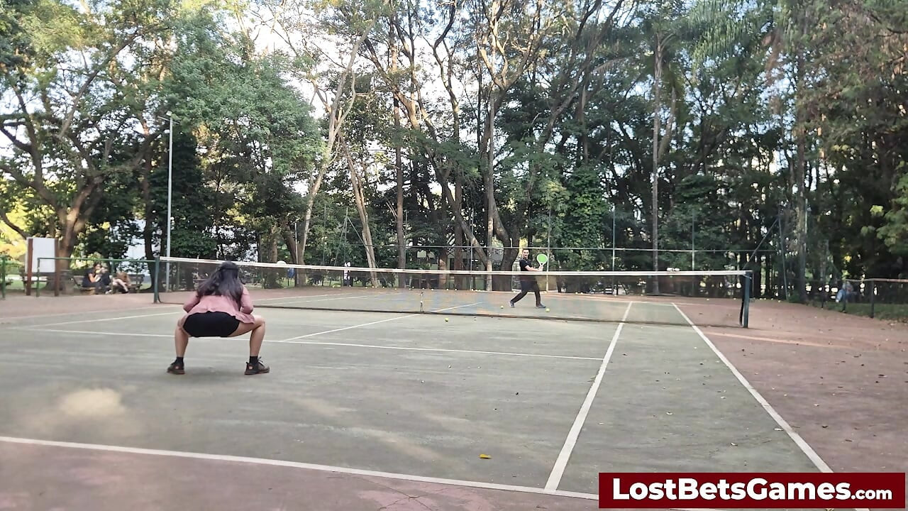 An outdoor strip tennis match with Rafaela and Igor