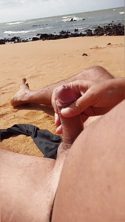 Ladysilva jerking off his big hot cock until he grasps on the deserted beach