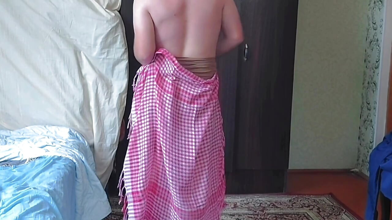 Cute sissy laying on sofa with soft pink blanket