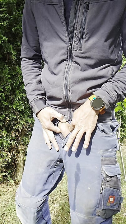 Young craftsman in Engelbert Strauss workwear pisses with his hard thick cock