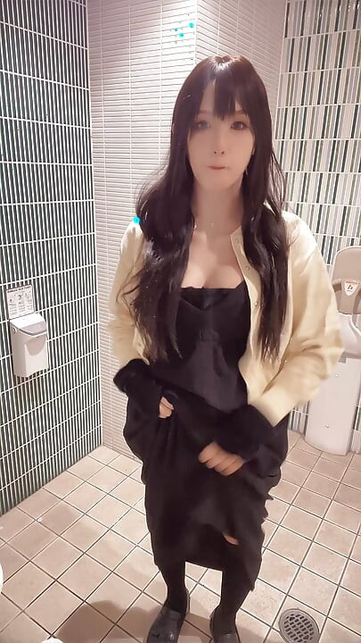 Video of a cross-dresser quietly masturbating in a public restroom
