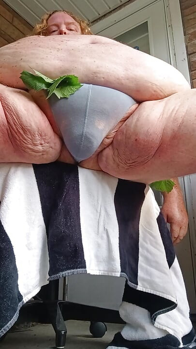 Early morning porch thong.  Fat guy slaps his nuts n shows ass