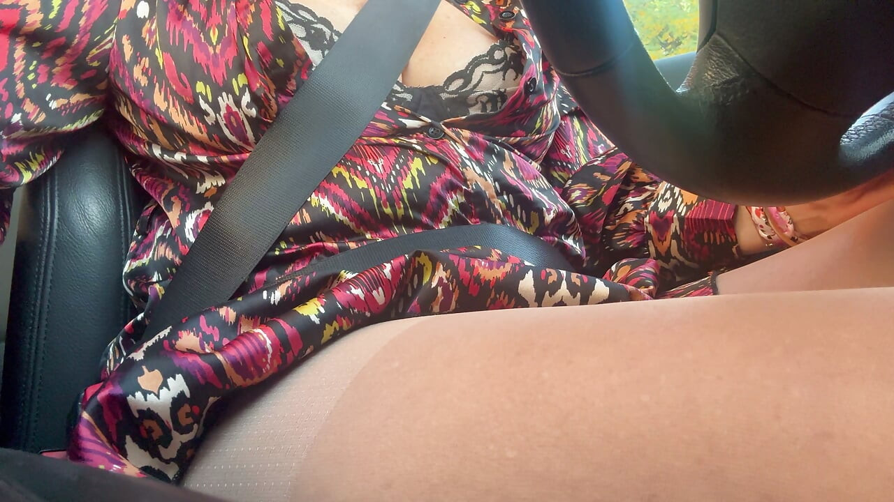 Sexy stepmom drives home and teases us with her big tits, which are practically popping out of her bra.