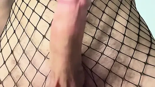 Solo femboy cums in fishnets