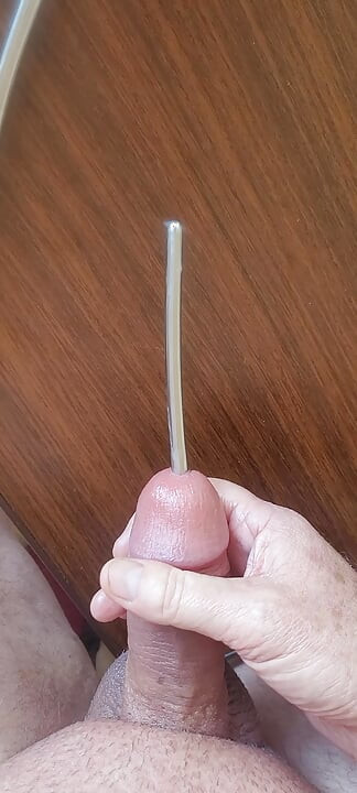 Masturbating my smooth cock with sounding rods before cumming