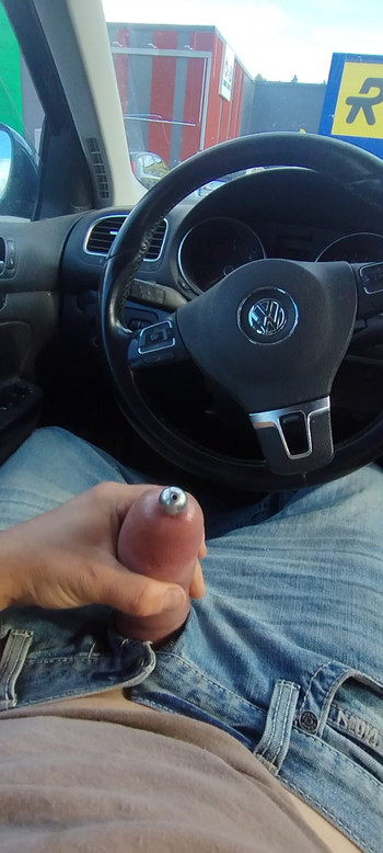 Wanking pumped cock with penis plug  in public parking