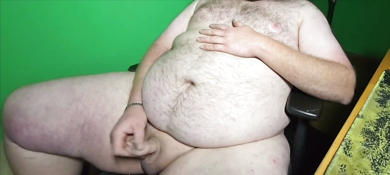 A fat boy with a small dick is masturbating.