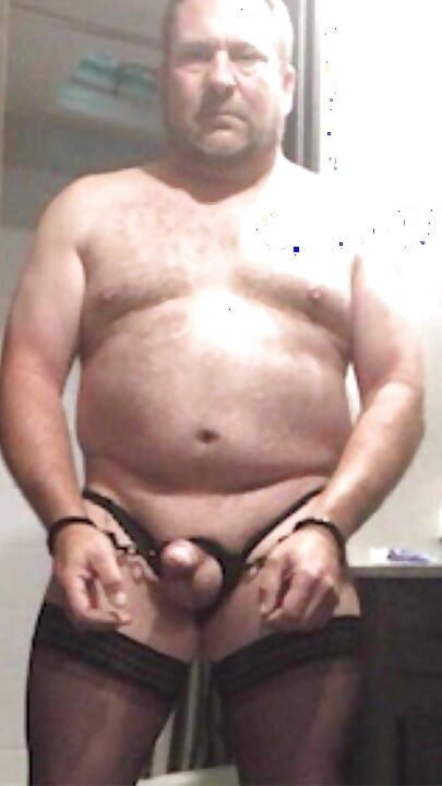 Brandon Hegsted wearing thigh highs, panties and handcuffs
