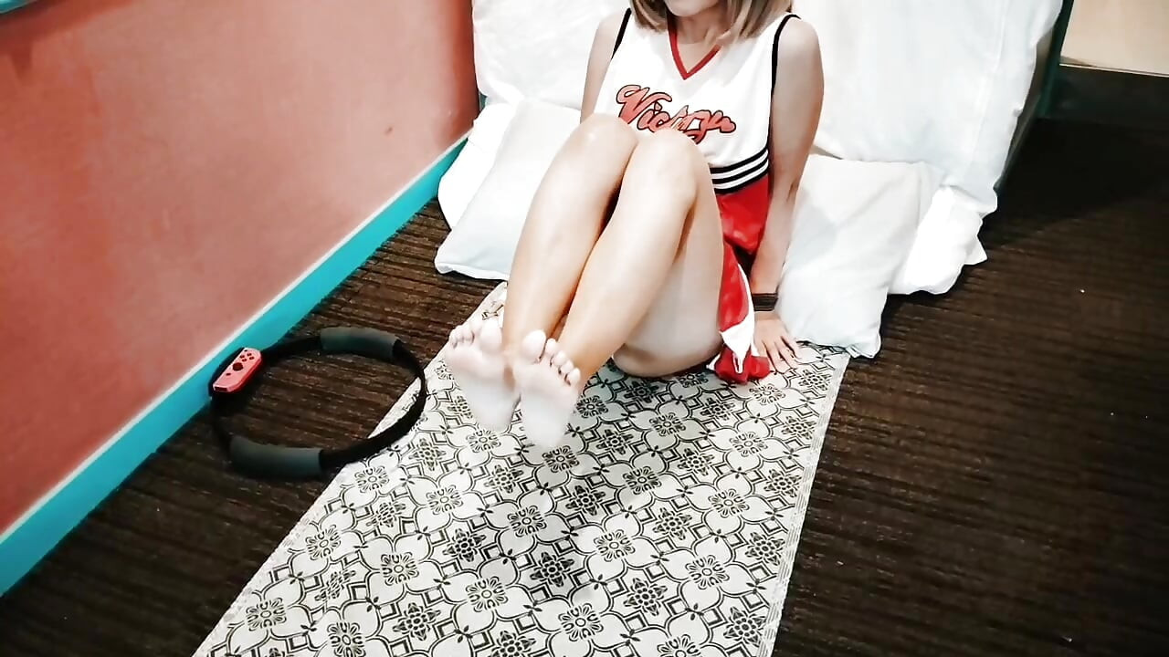 A cute, busty married woman does exercise 1 in an erotic cheerleader costume. Home made amateur Private Shoot