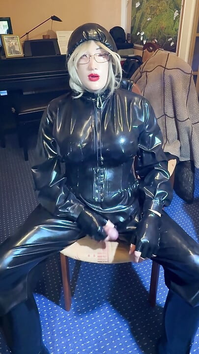 the latex slave has to do it himself