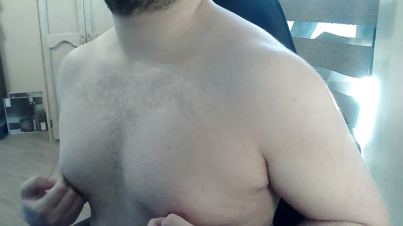Muscular stud plays with his nipples and muscles