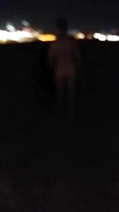 Naked Walking on the Hill Along Highway