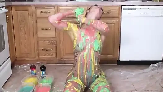 Hot girl puts colors  all on her tits and her pussy in the kitchen