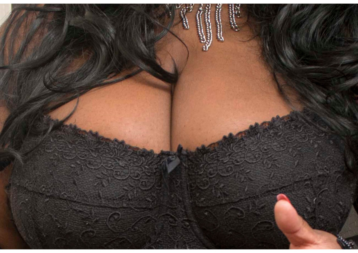 Sexy ebony Milf in black lace seductively teases you with her huge natural boobs