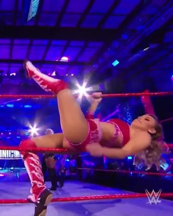 WWE - Peyton Royce laying on the ropes
