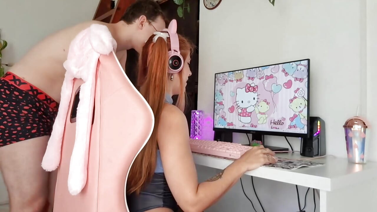 Gamer girl playing LOL while she's fucked doggystyle