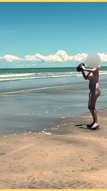 Jaw-dropping moment from "Wifey strips nude and plays with the football at the beach"