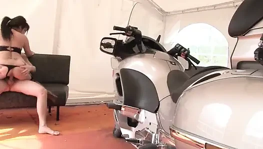 Horny brunette gets fucked on motorcycle