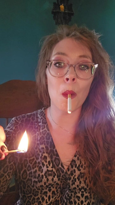 Cigarette Dangling while lighting a match