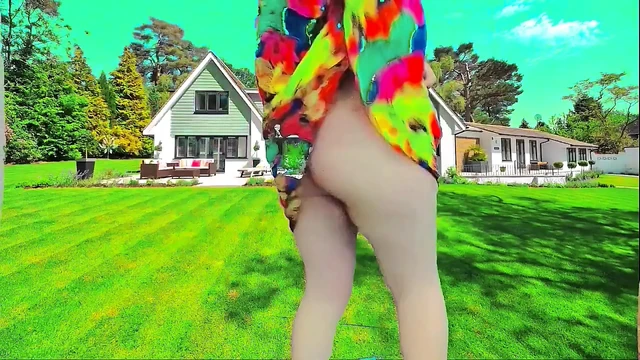 Sweet shemale walking through garden in summer breeze