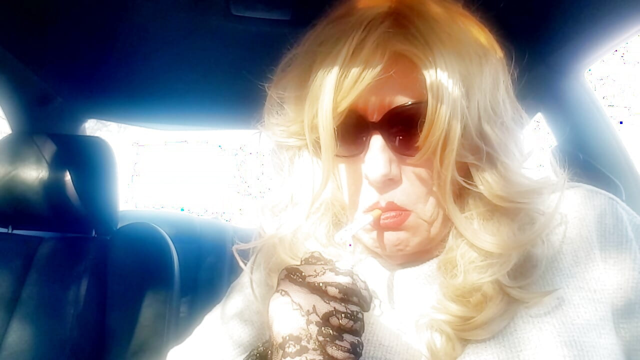 MRS. ROMAN SMOKING MARLBORO 100's IN HER CAR