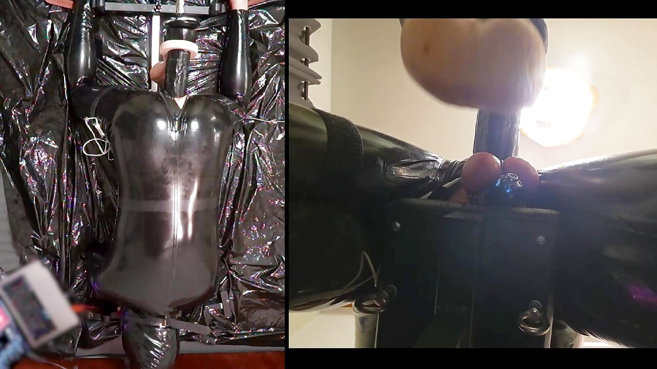 Session in the pillory with Latex Catsuit, PA Chastity, Giant Didildo and Estim