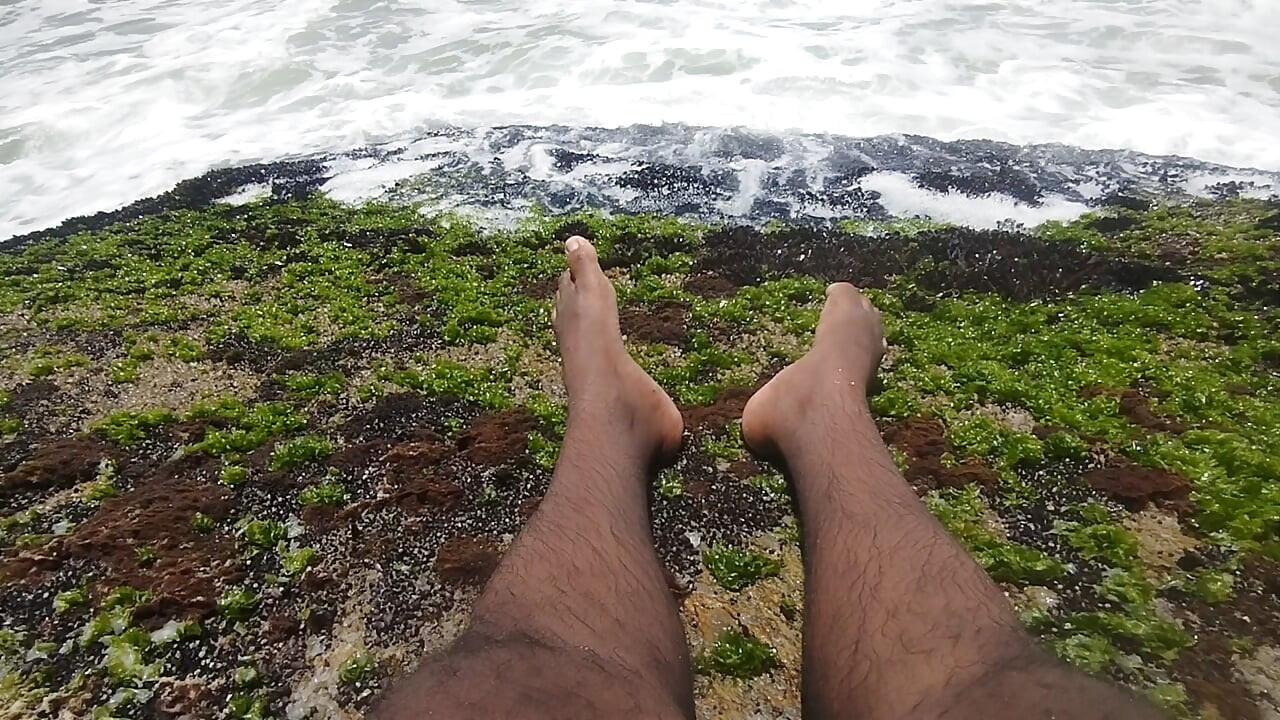 massaging my feet on the beach