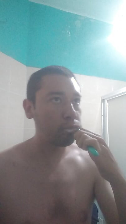 Man washes his face
