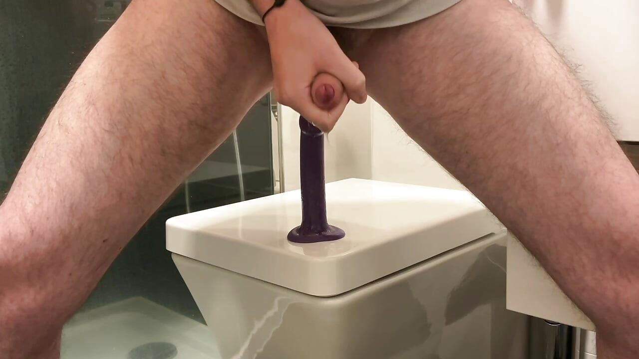 Cumshot after fucking a dildo in the bathroom