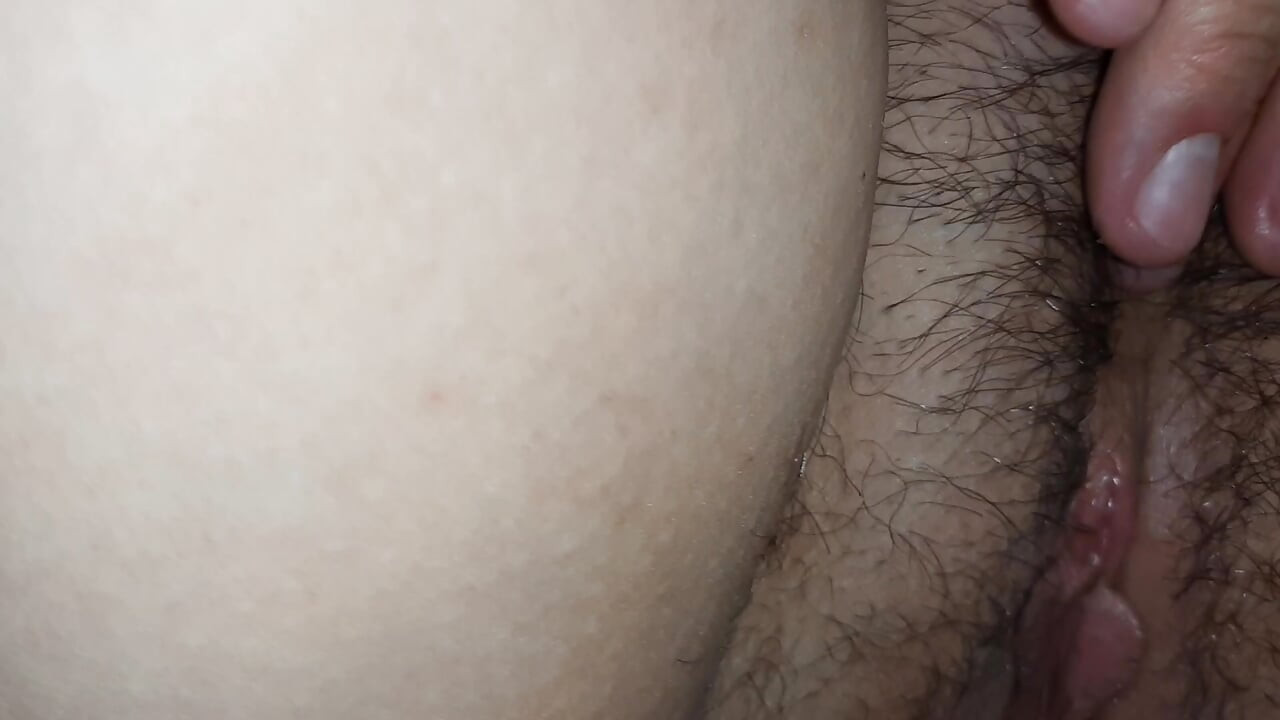 I squeeze her tits hard and help her cum