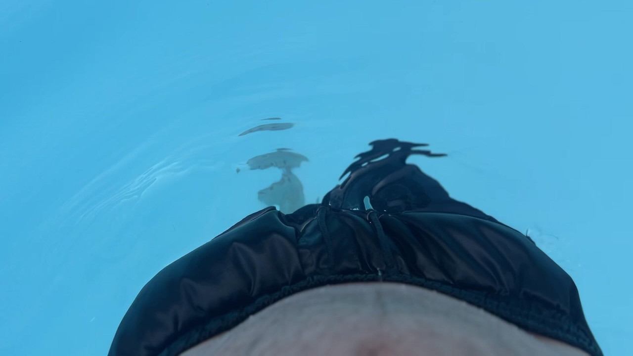 Huge boner in black satin shorts in public pool