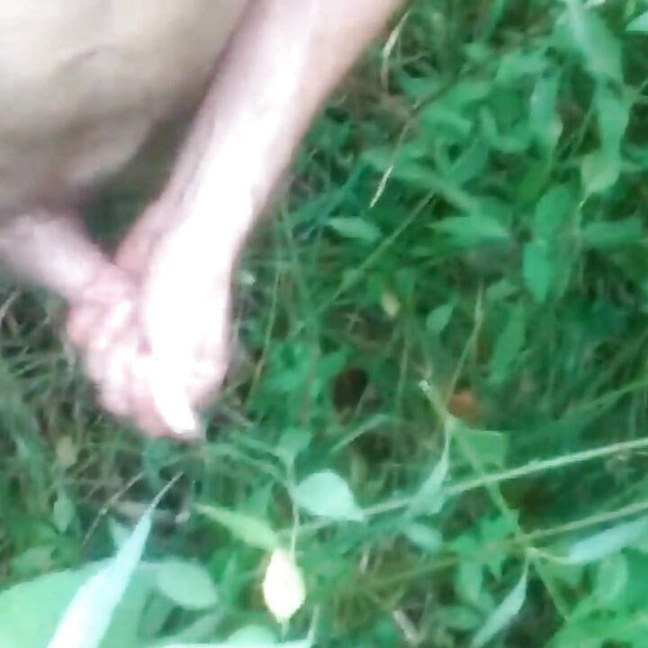 Outside in a field naked jacking off