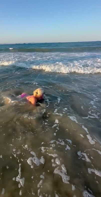 Try Not to Wet My Hair While Play with the Waves
