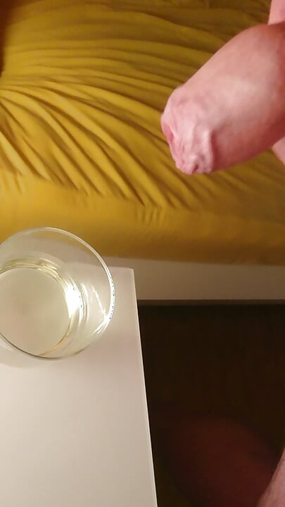Cumming into a glass of pee