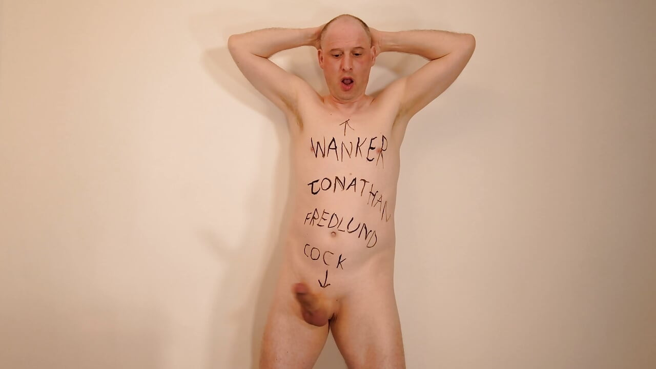 Jonathan writes cock, wanker and name on his shaved body and masturbates his uncut erect dick as he paints on himself