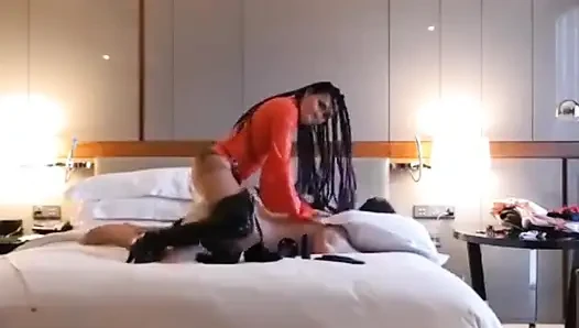 Pegging slave in hotel wearing red latex
