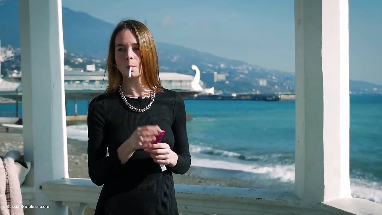 Young Russian Girl Smoking Cigarette by Seaside