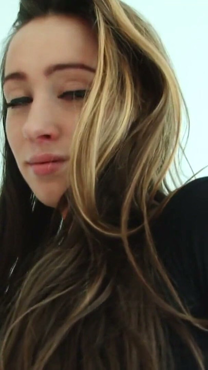 Brunette in sexy shiny trousers bends over to show he shiny ass | Clip 1