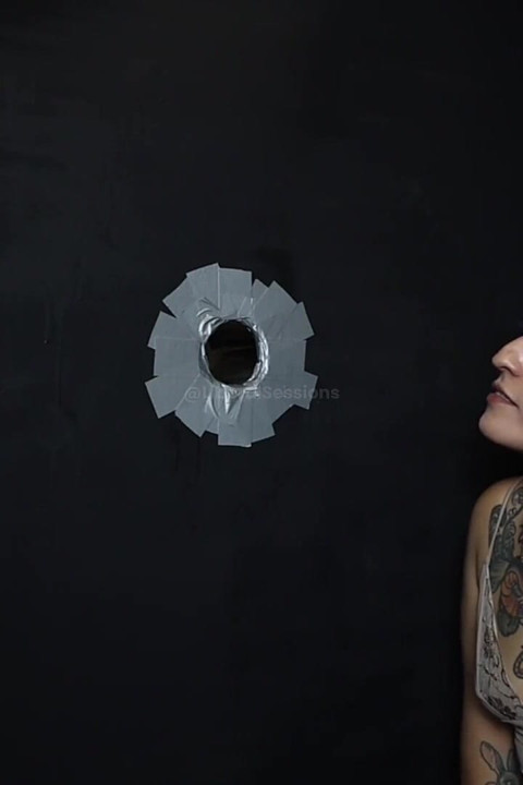 She Gets Fucked in a Glory Hole with a Fist in Her Pussy