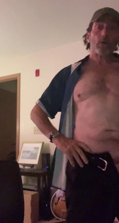 Just a guy getting home from work and getting naked.