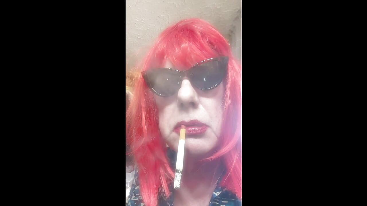 MRS. ROMAN DESTROYING A MARLBORO 100 MENTHOL CLOSE UP - WITH DANGLING AND NOSTRIL EXHALES