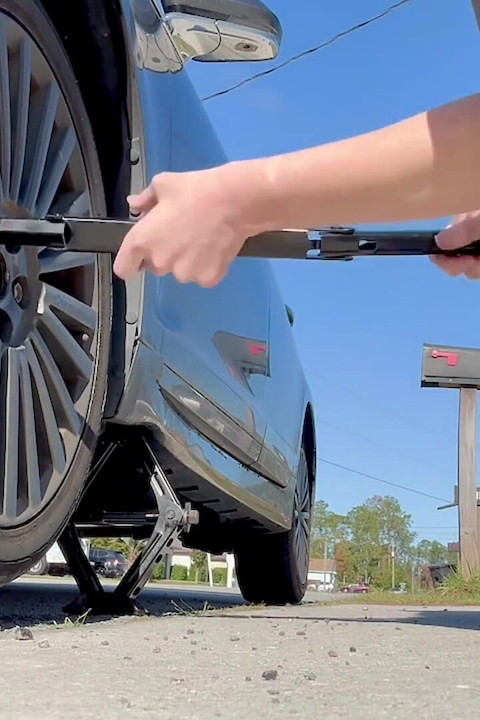 67 Tall Amazon Goddess Changes Her Tire - Big Feet in Frame