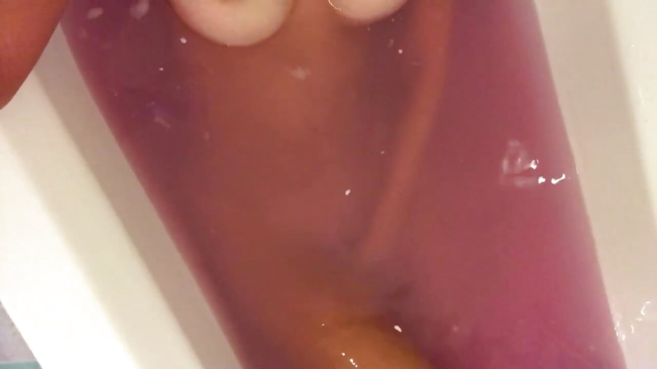 Nasty chick with big boobs talks dirty in the bathroom