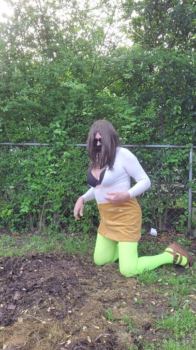 Stunning moment from "Gay crossdress tease, outdoors ground humping in pantyhose, black bra, miniskirt."
