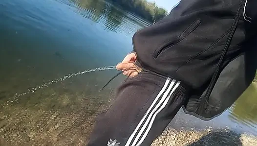 Who will spot this twink in a black and white adidas tracksuit, flashing his cock in public going commando freeballing, peeing i