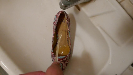 Piss in stiletto high heel