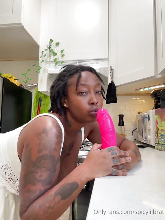 Nasty Ebony Bitch Sucks Dildo with Passion