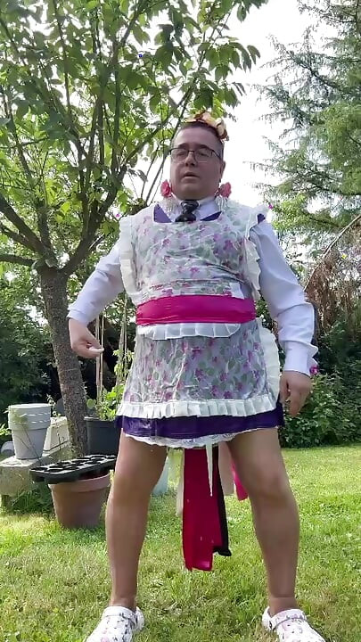 In gardener's clothes to take a piss shower outside fully dressed