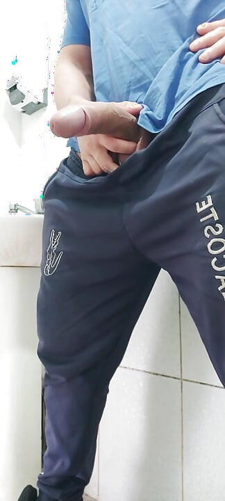 A Well-endowed Brazilian Man Urinating and Showing His Thick Penis to His Female Friends.